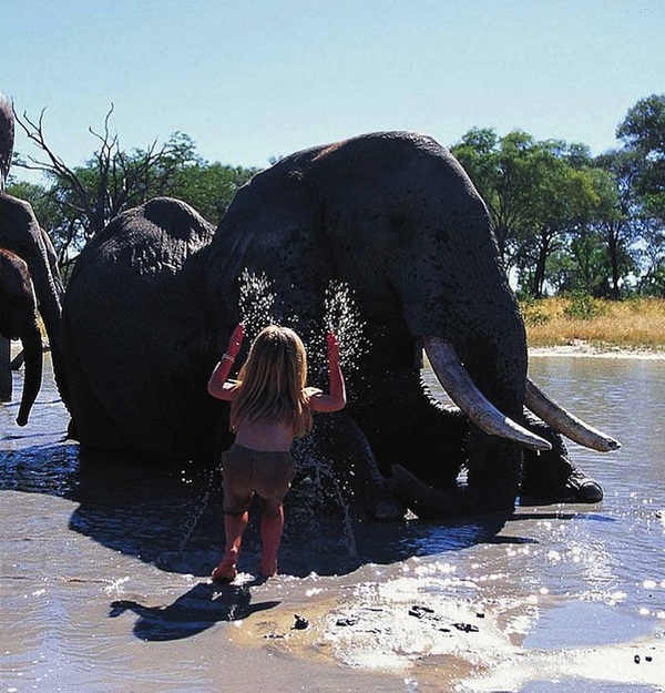 Young girl who’s best friends with African wildlife