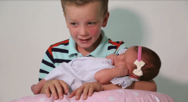 family of boys welcome new baby girl 3