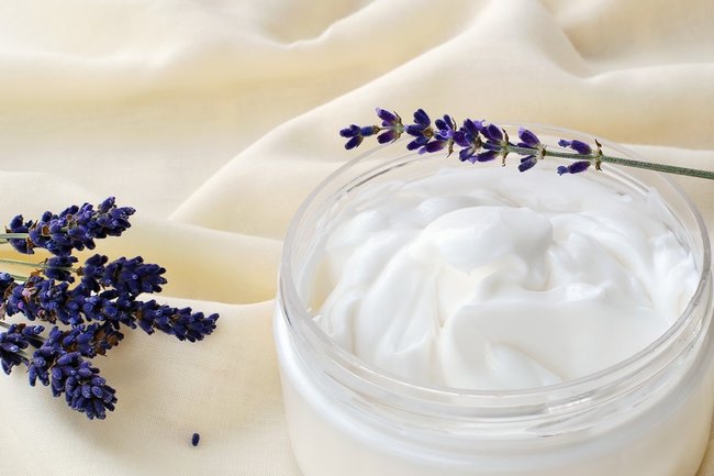 Skin moisturizer - cosmetic cream in a transparent jar.