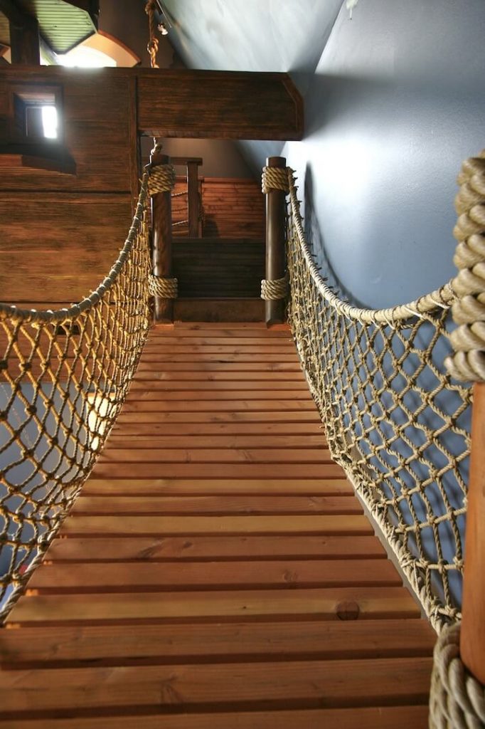 rope bridge inside the room themed like a pirate ship