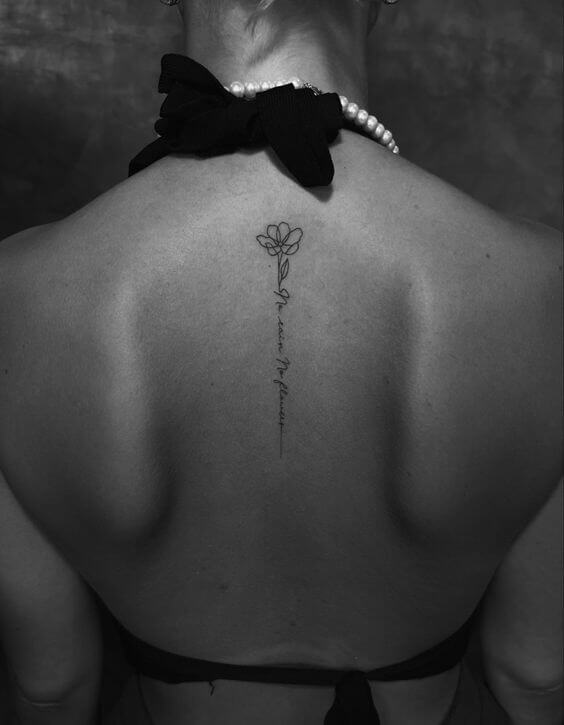 spine tattoo of no flowers no rain