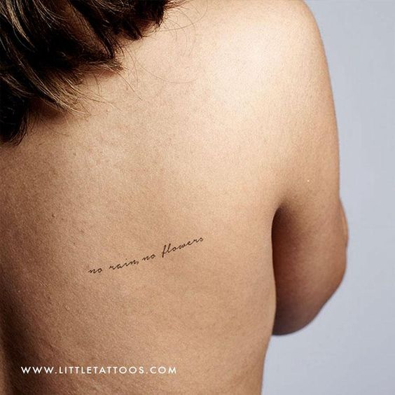 side back tattoo with the words no rain no flowers