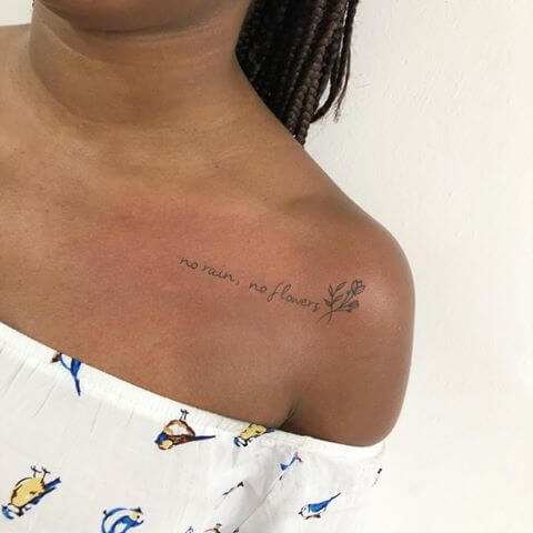 Shoulder tattoo saying the phrase 