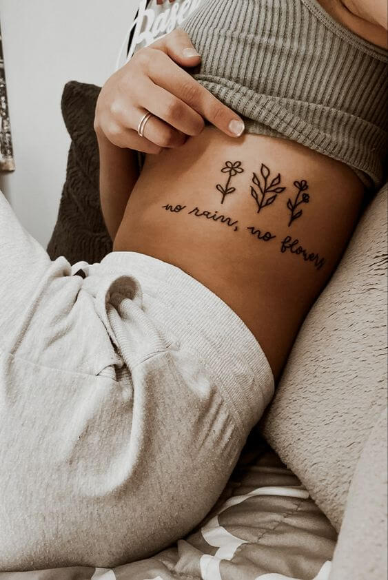 ribs tattoo with flowers 