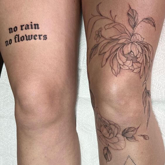 huge leg tattoo of no rain no flowers