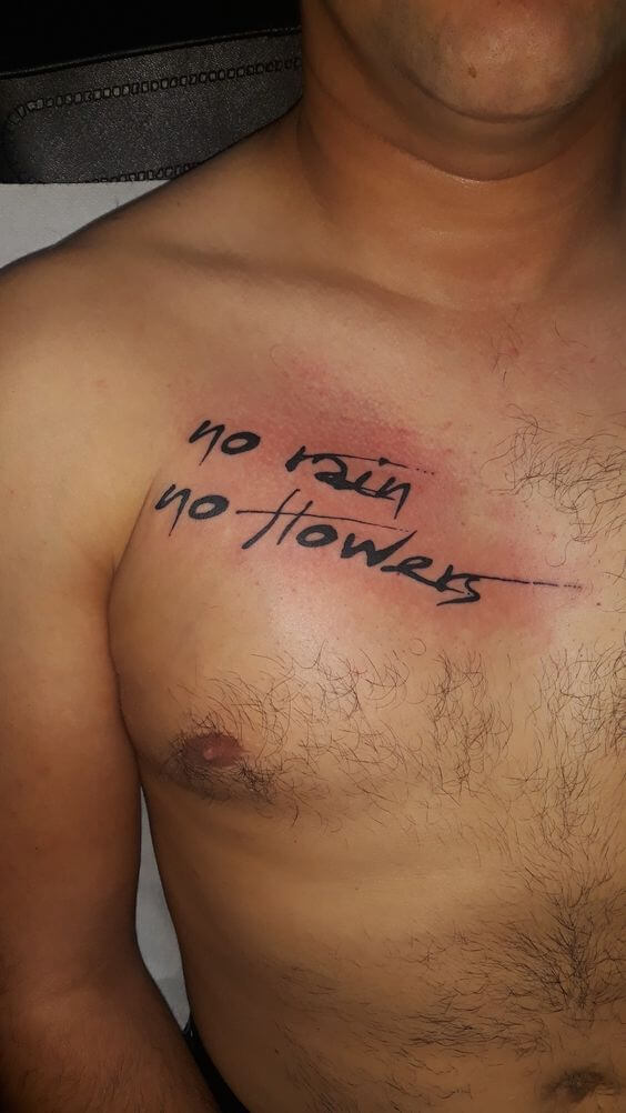 chest tattoo with text